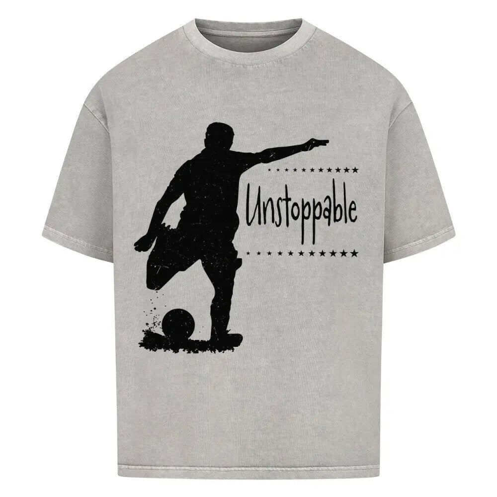 Unstoppable Football Oversized T-Shirt: Graumeliertes oversized Shirt mit schwarzem Frontprint: Fußballspieler und dem Schriftzug „Unstoppable“.