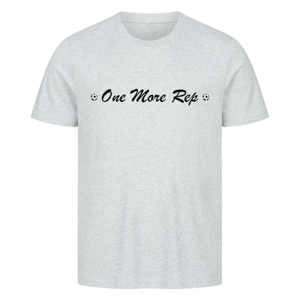 Premium One More Rep Shirt: Hellgraues T-Shirt mit schwarzem Schriftzug „⚽ One More Rep ⚽“ auf der Brust.