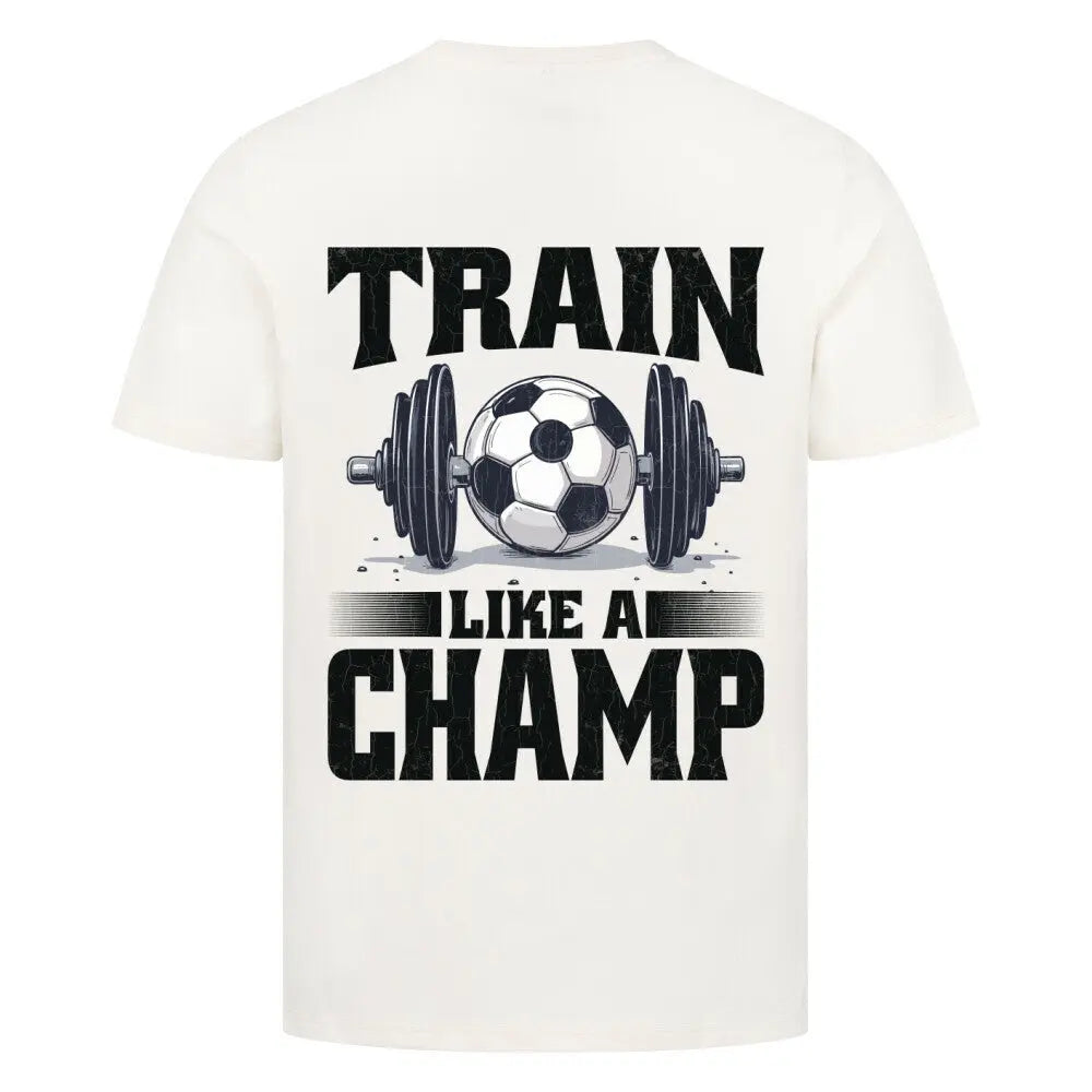 Train like a Champ Premium T-Shirt: Naturfarbenes T-Shirt mit Rückenmotiv: weiße Hantel mit Fußball in der Mitte und Statement „Train Like a Champ“ in dunklem Kontrast